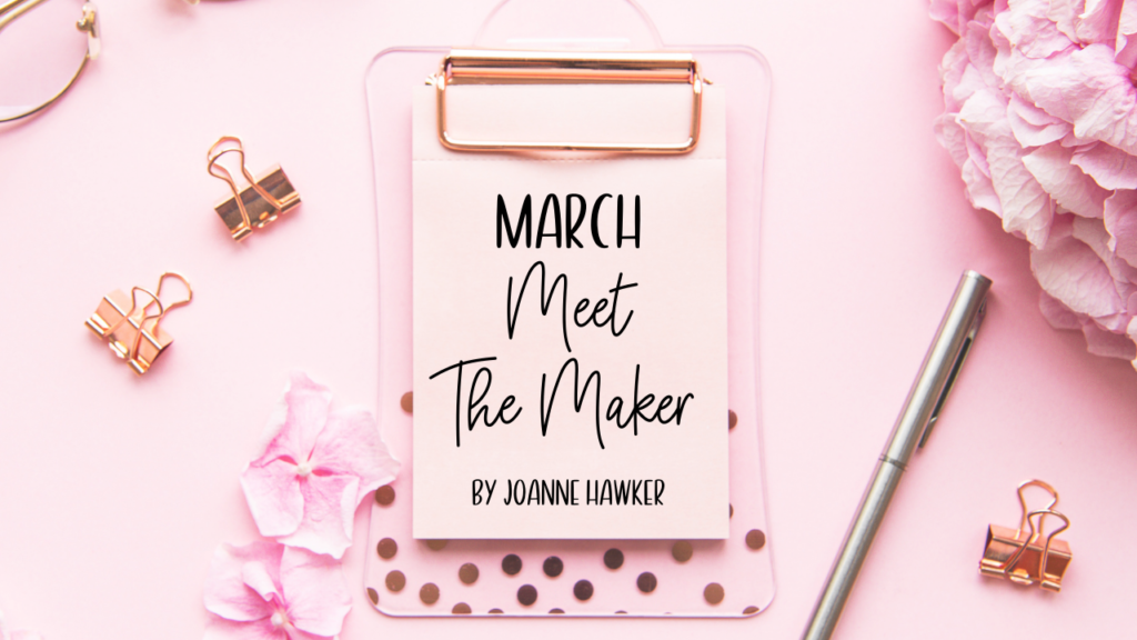 pink desktop with binder clips and flower and clipboard with title march meet the maker by joanne 