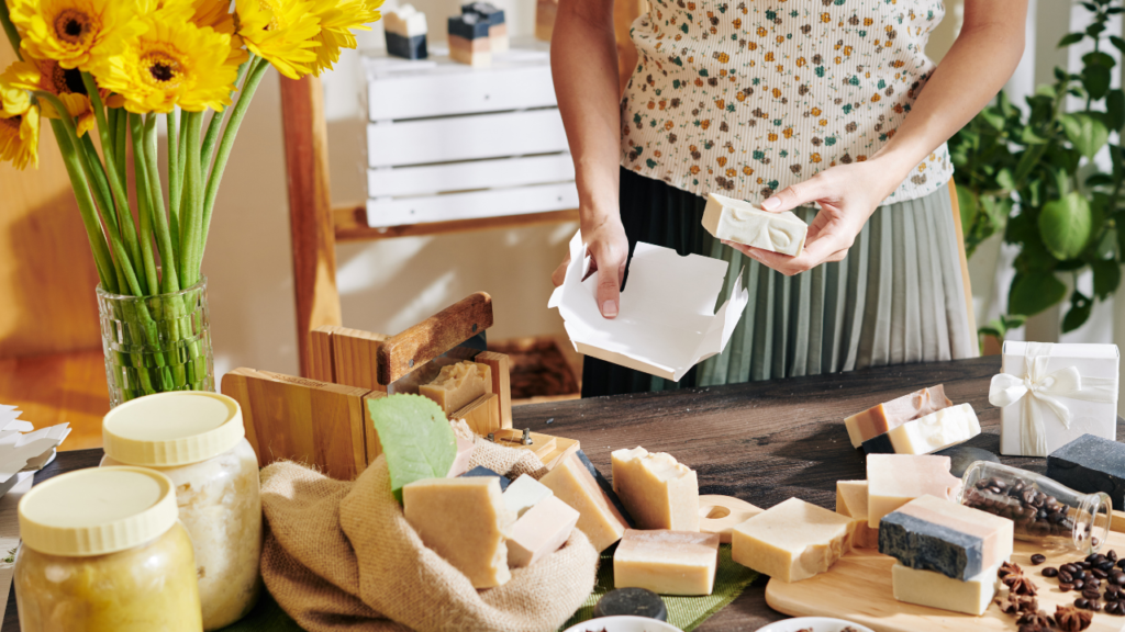 woman packing handmade soap using shipping tips to make sure packages are professional