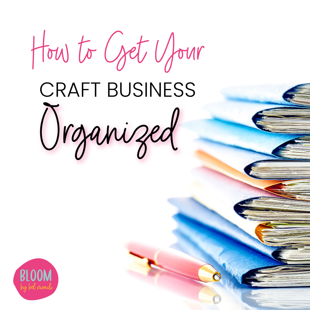 A pile of papers in folders and a pen with the title how to get your craft business organized