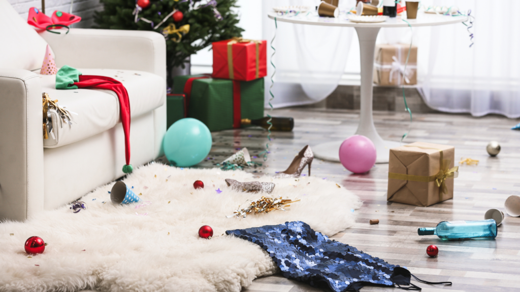 post holiday marketing a living room showing and after party mess with ornaments and decorations on the floor.