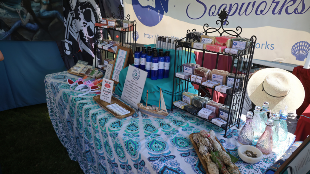handmade business at a craft show - homemade bath and body products on a table